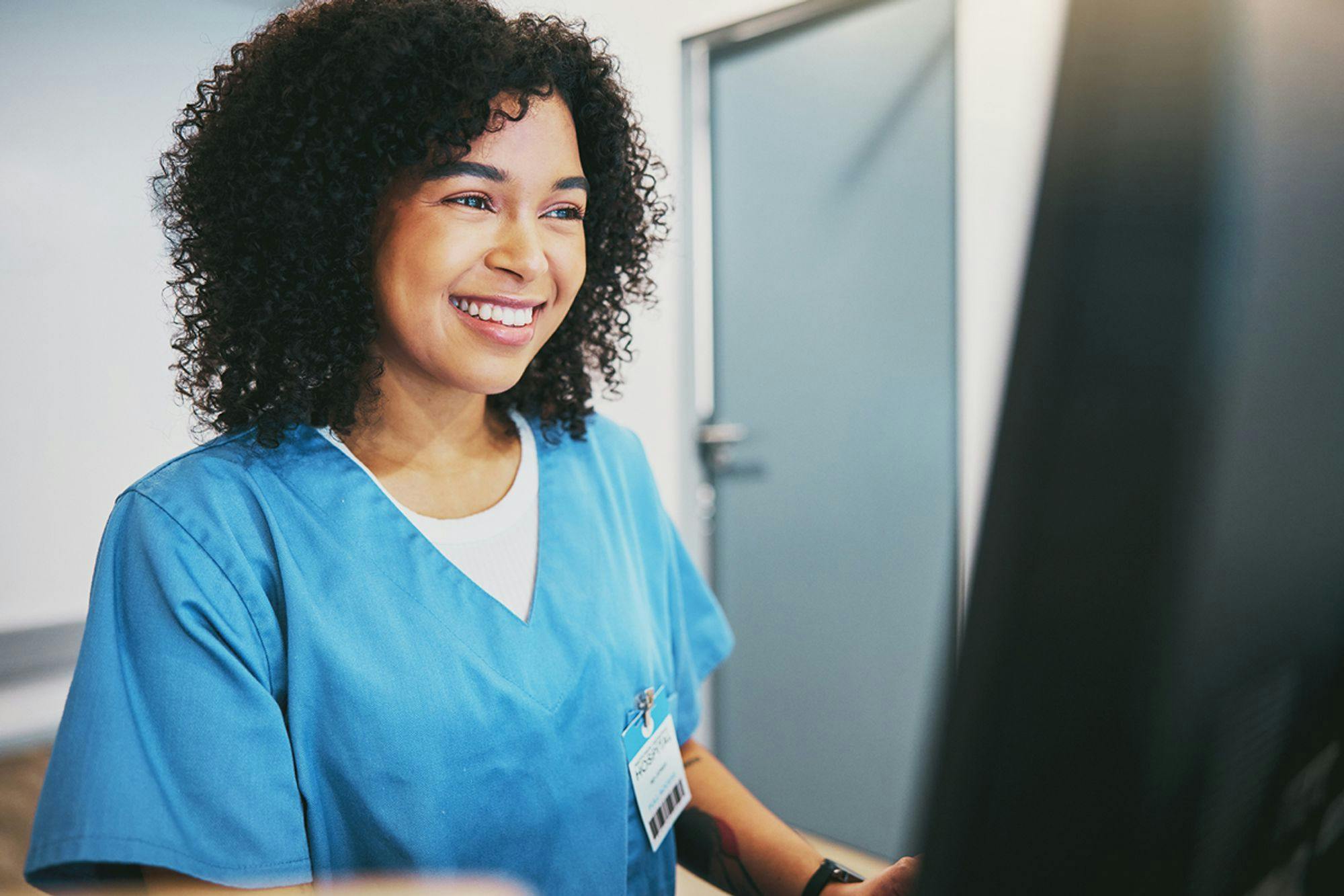Healthcare nurse, physician, or doctor using TAG on a computer for healthcare reports and managing enterprise assets.