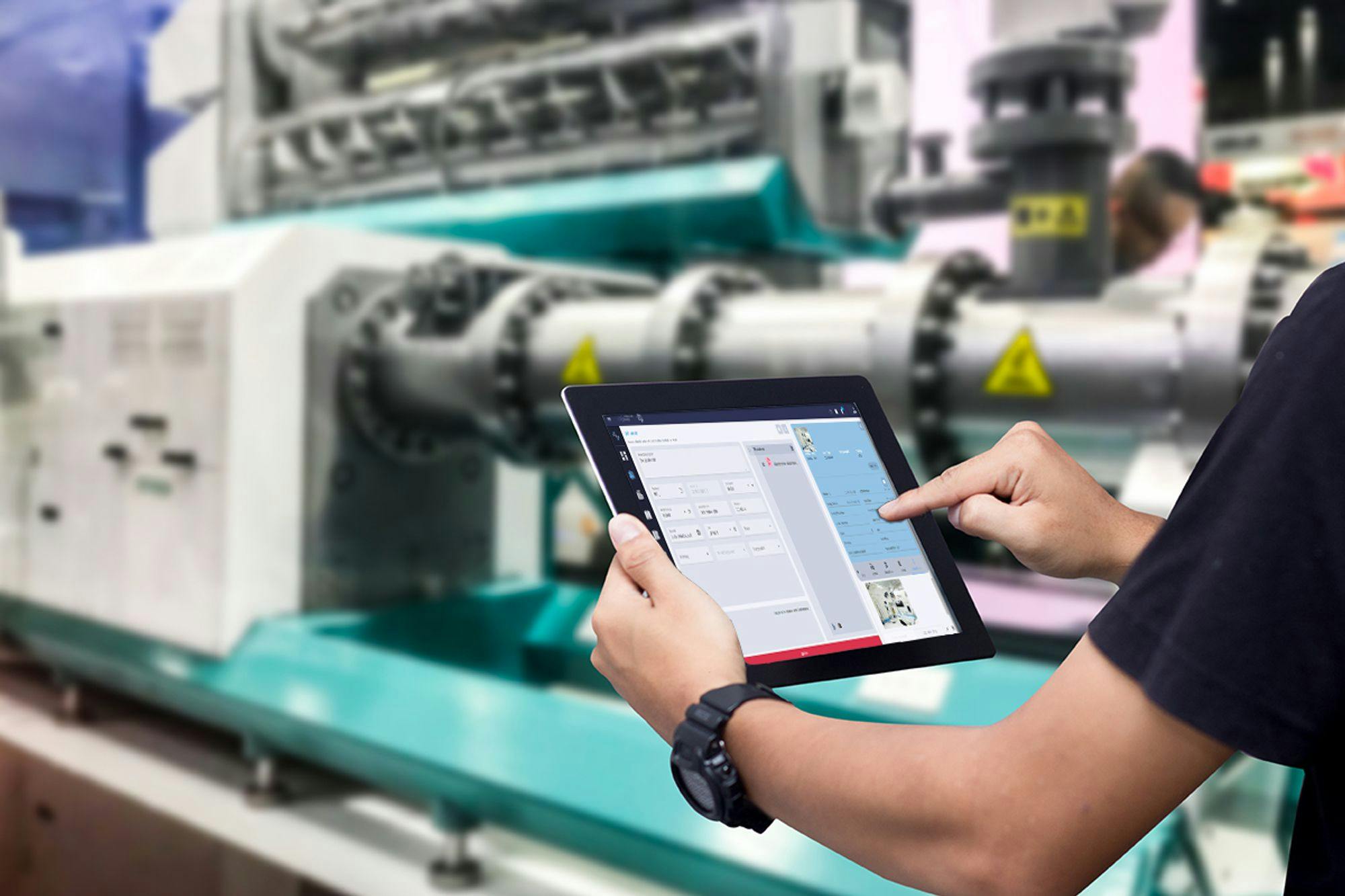 Technician using The Asset Guardian - TAG to manage and automate manufacturing assets with AI and intelligent solutions.